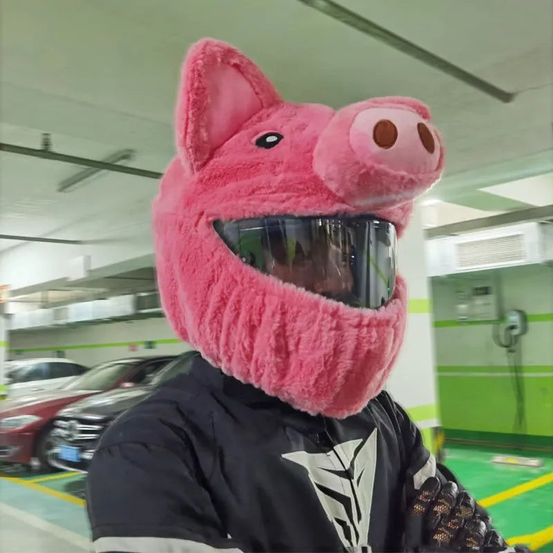 Pink plush cartoon-style protective hood for helmets on a white background.
