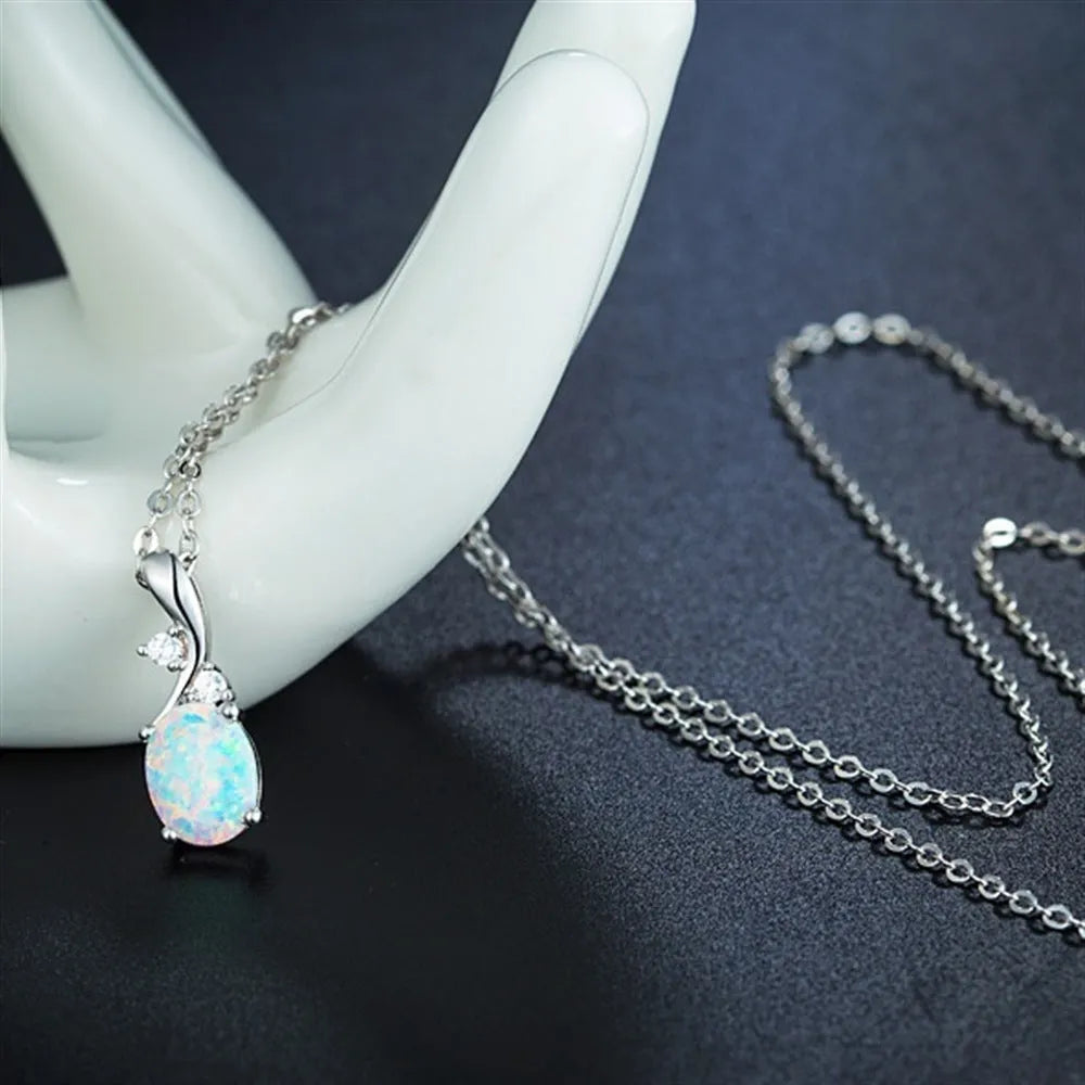 Water drop shaped opal pendant on adjustable chain necklace in rose gold or white finish