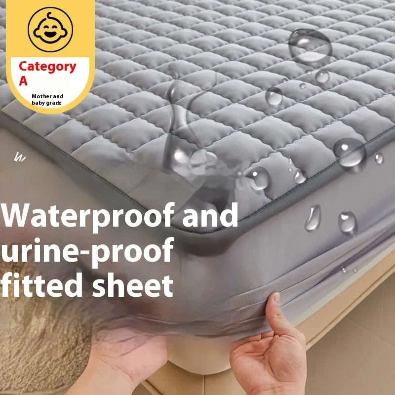 A washed cotton waterproof fitted sheet in a neutral colour, shown fitted neatly on a mattress corner.