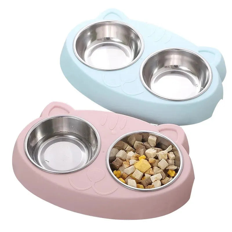 Blue macaron-shaped plastic pet feeding tray with two bowls for cats and small dogs on a white surface