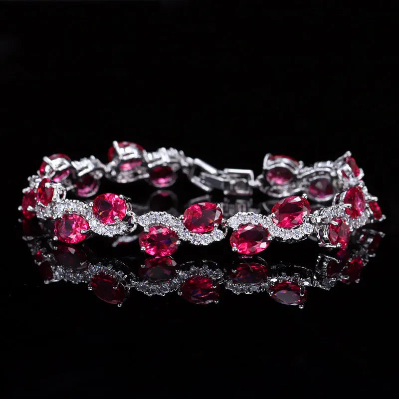 Geometric women's bracelet with zircon stones and gold-electroplated finish on copper base