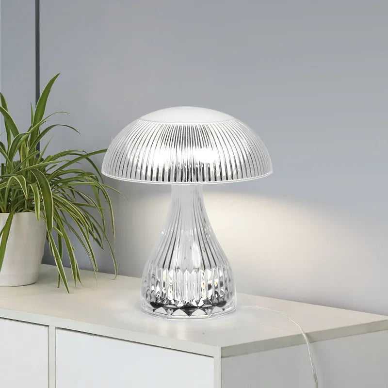 White rechargeable three-colour changing LED table lamp with acrylic light body.