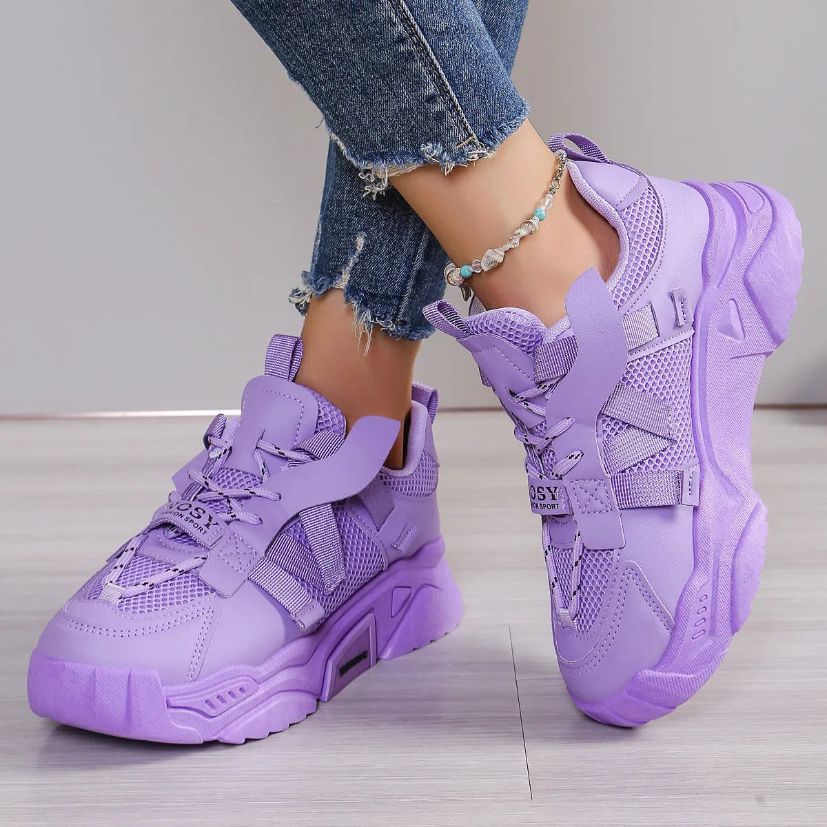 Women's purple platform mesh dad shoes with animal pattern and lace-up front.