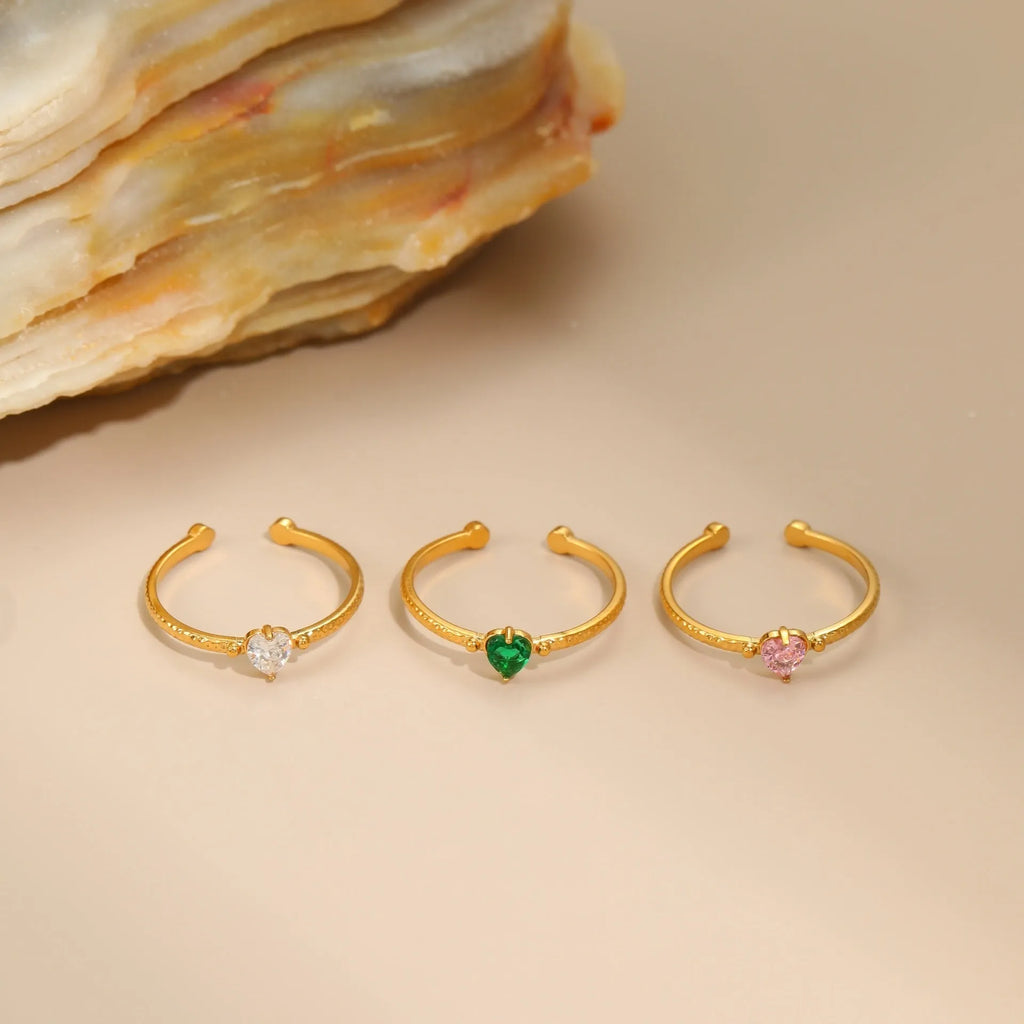 Open ended stainless steel ring with heart-shaped zirconium inlay in white, pink or green