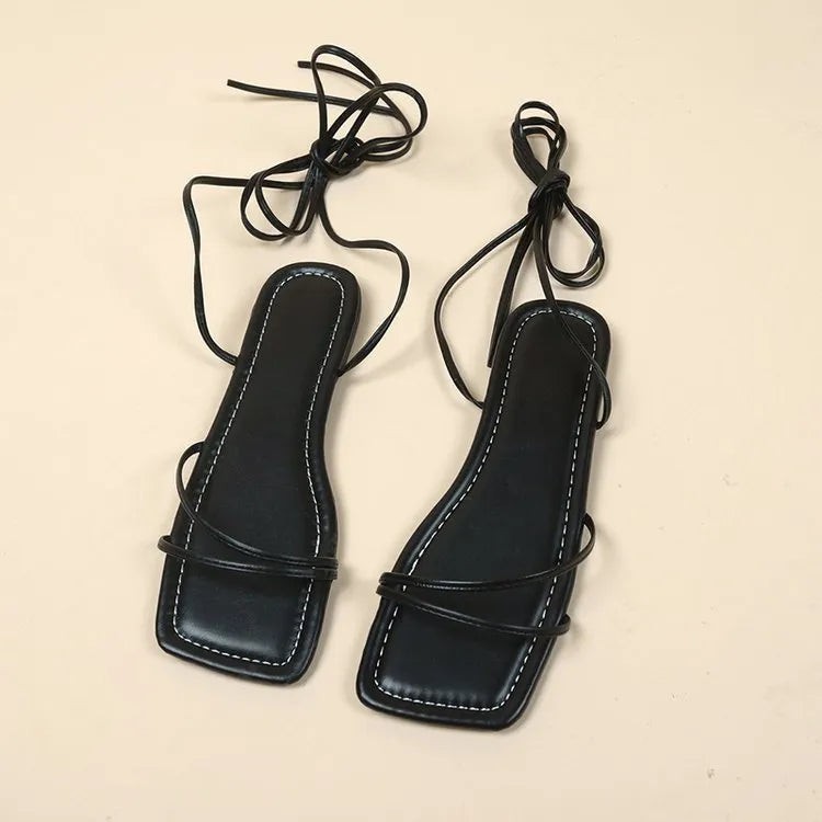 Women's flat sandals with ankle ring bandage cloth detail and front lace-up fastening in solid colour