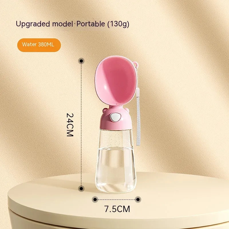 Portable dog water bottle with an attached feeding bowl in yellow, for outdoor travel.