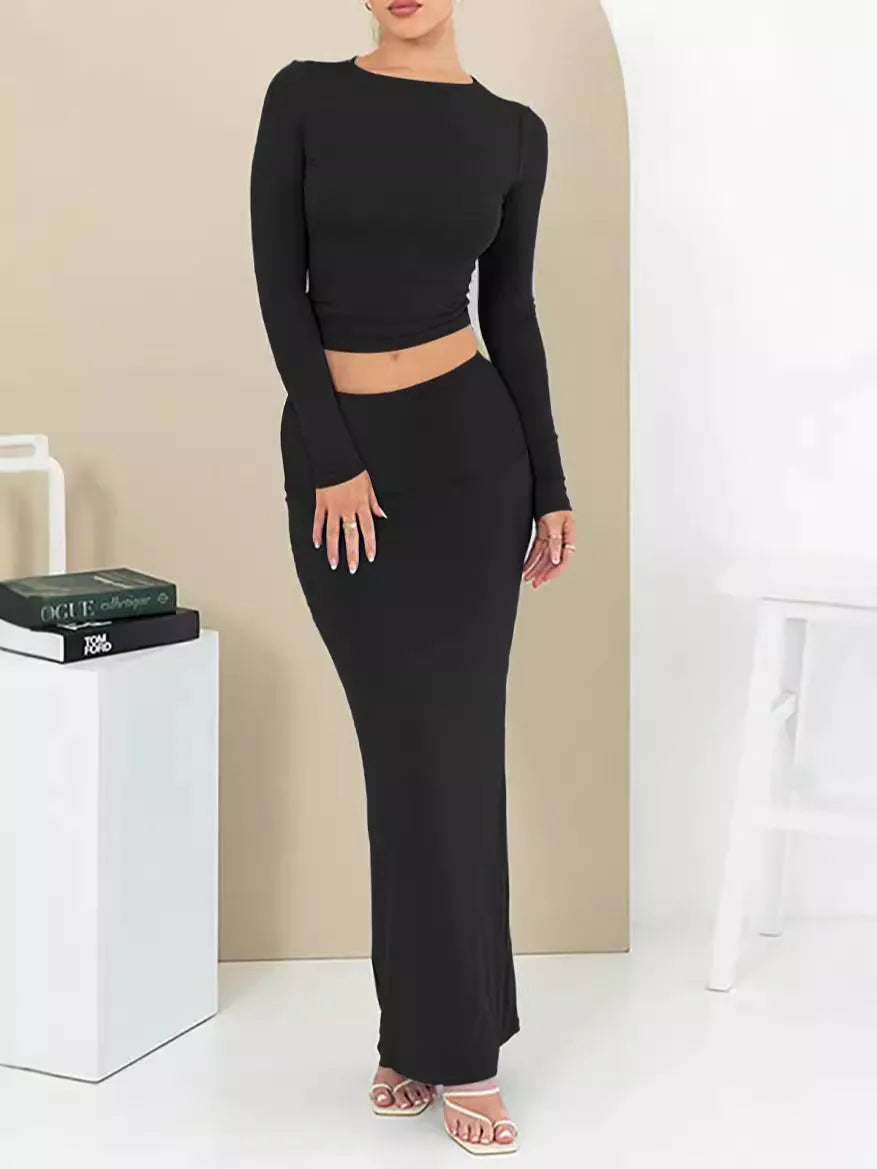 Women's sweet style two-piece suit set with long skirt and three-quarter sleeves in solid colour.