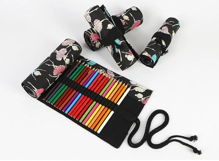Square canvas rolling pencil case with ballet girl print, showing multiple pencil slots inside.