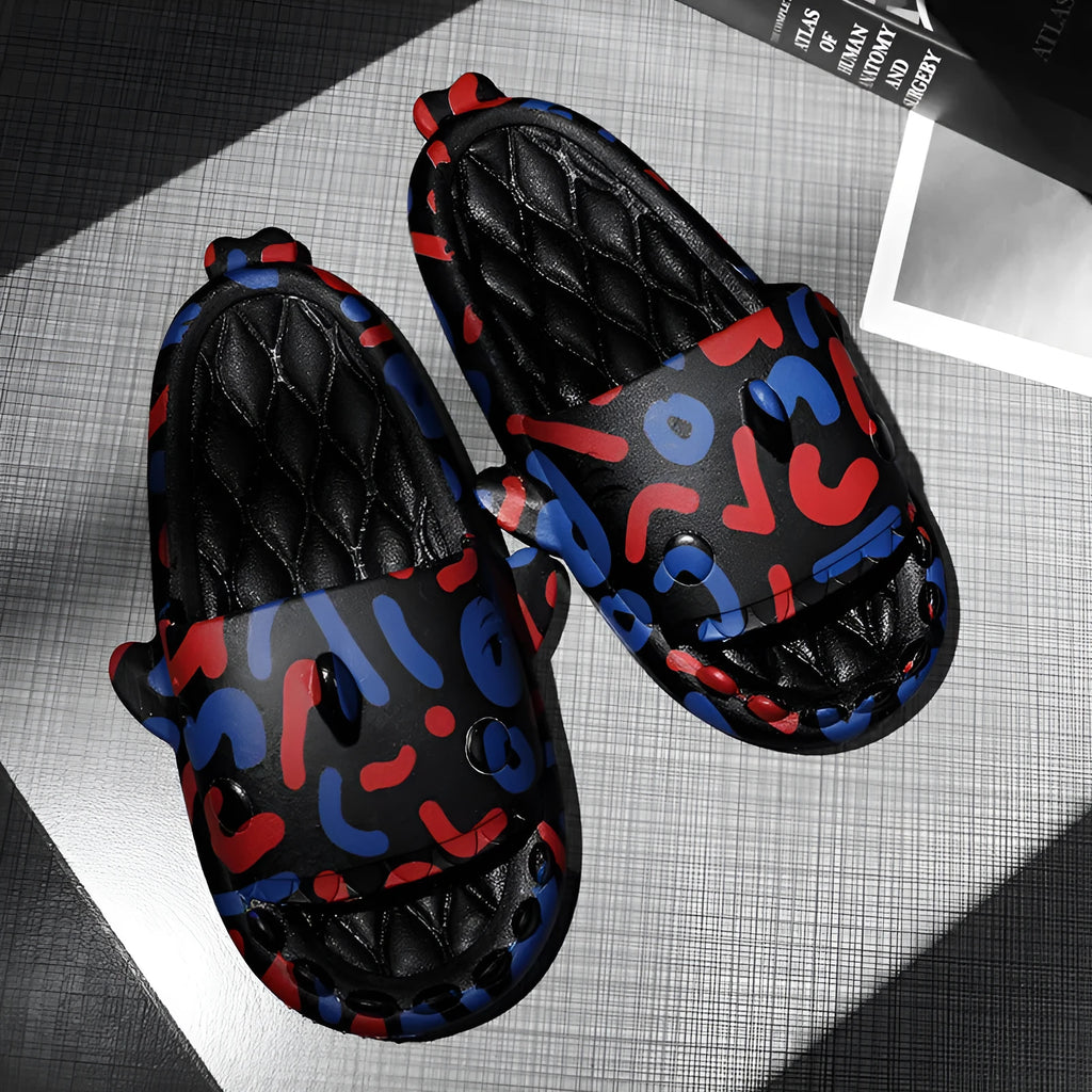Cute shark design open toe EVA home slippers in assorted colours on a white background.