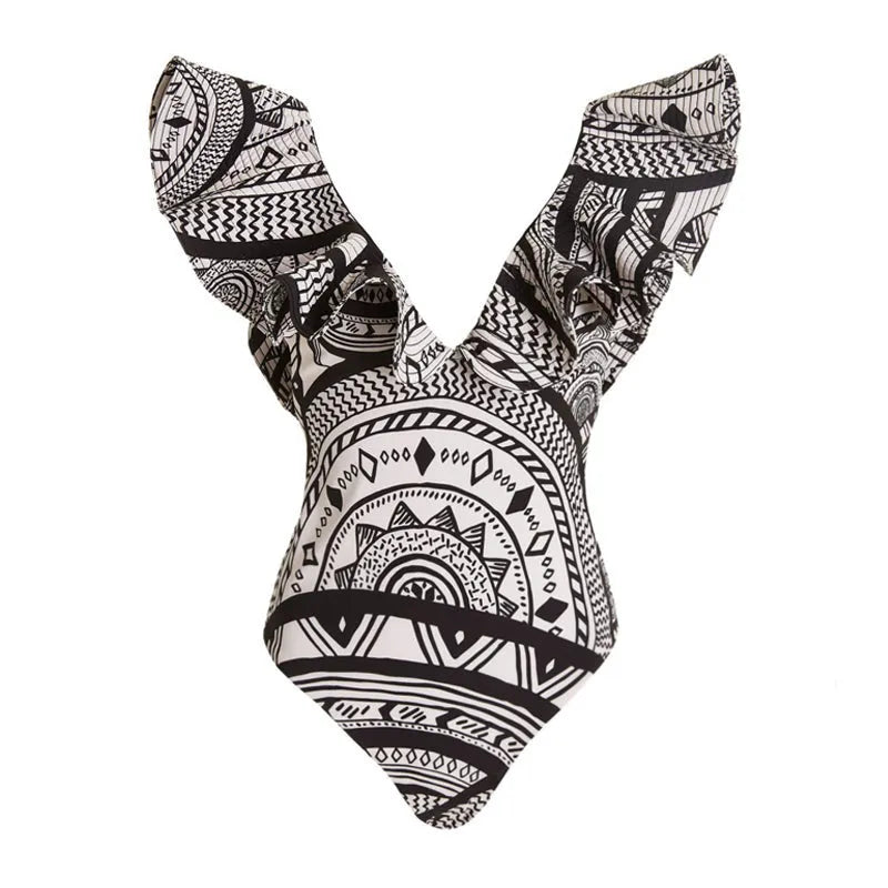 Women's vintage print one-piece swimsuit with deep V-neck and ruffles, shown with matching wrap skirt.