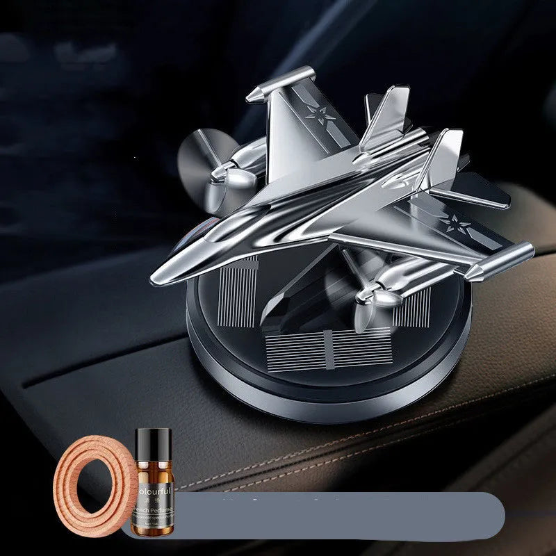 Solar powered rotating silver fighter jet perfume ornament with aluminium alloy seat and essential oil.