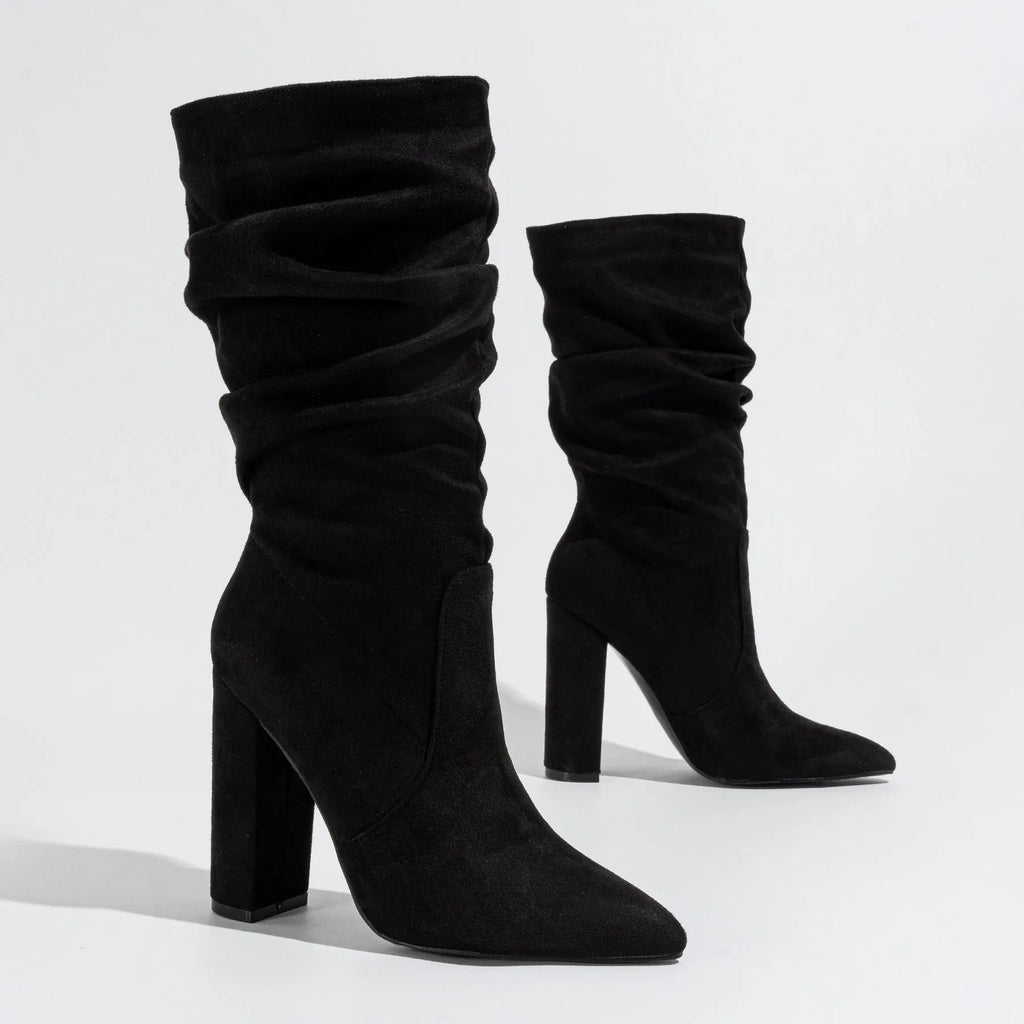 Women's black suede chunky heel pointed-toe mid-calf boots on a white background.