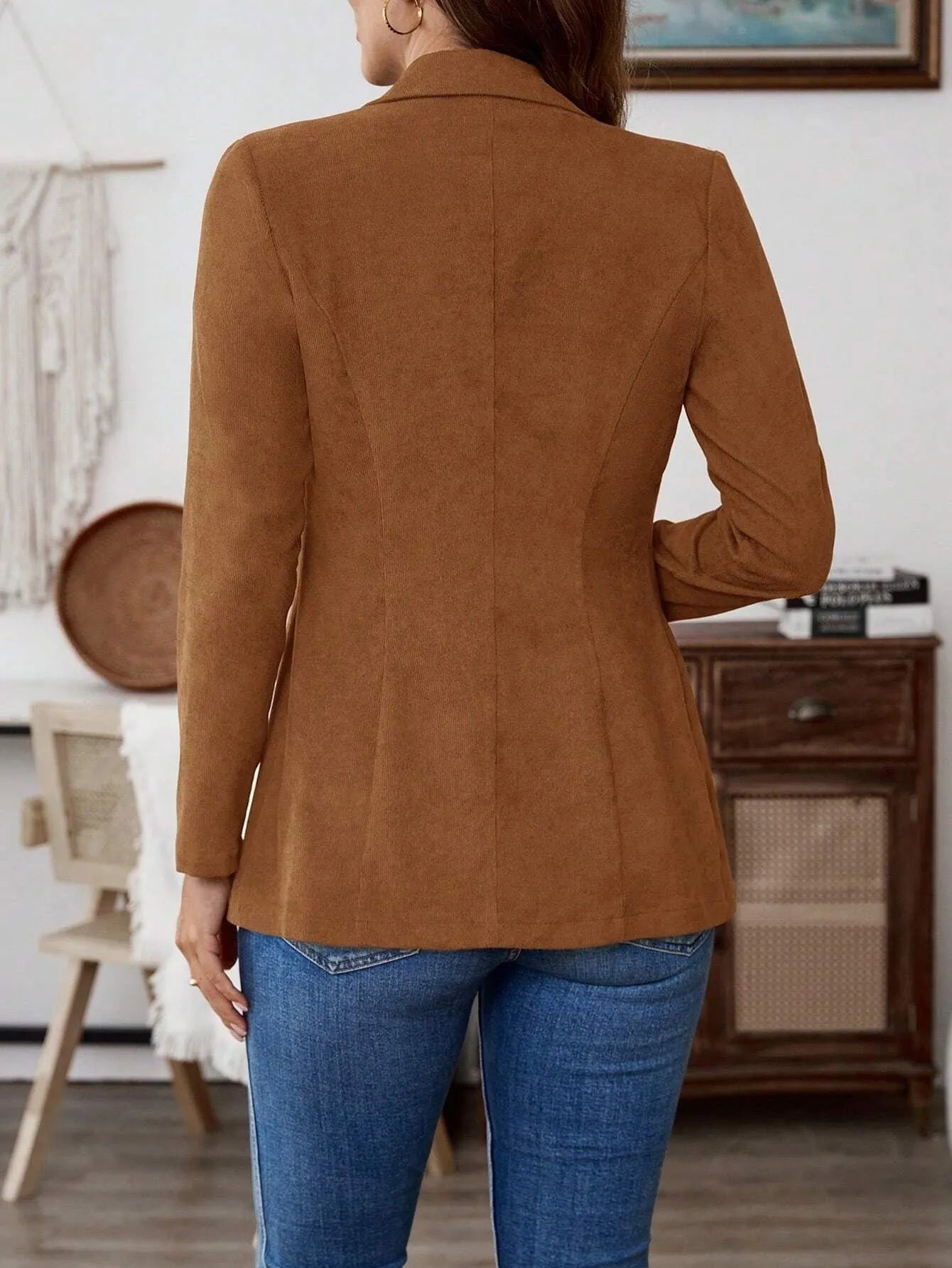 Brown single-breasted suit coat with lapel collar and long sleeves