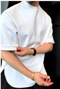 A white men's T-shirt with buttoned front and round hem laid flat.