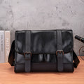 Black Korean style men's anti-theft backpack made from PU leather with visible sewing thread detailing.