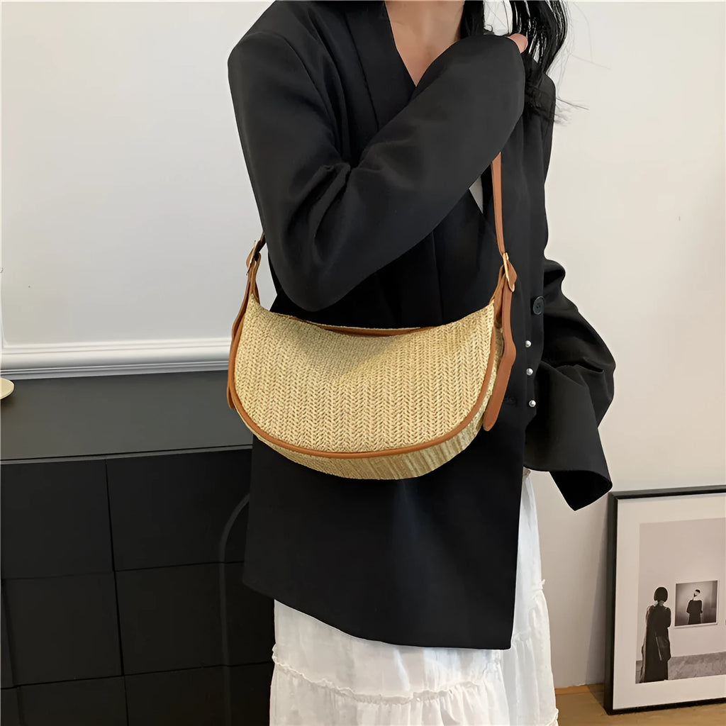 Knitted straw woven crossbody bag showing woven texture and internal organisation pockets