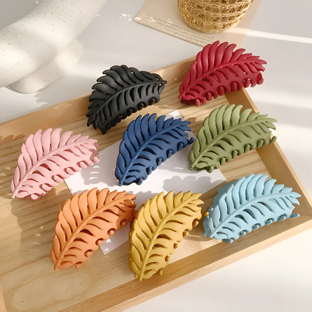 Frosted leaf hairpin side clip with rainbow detail in black colour