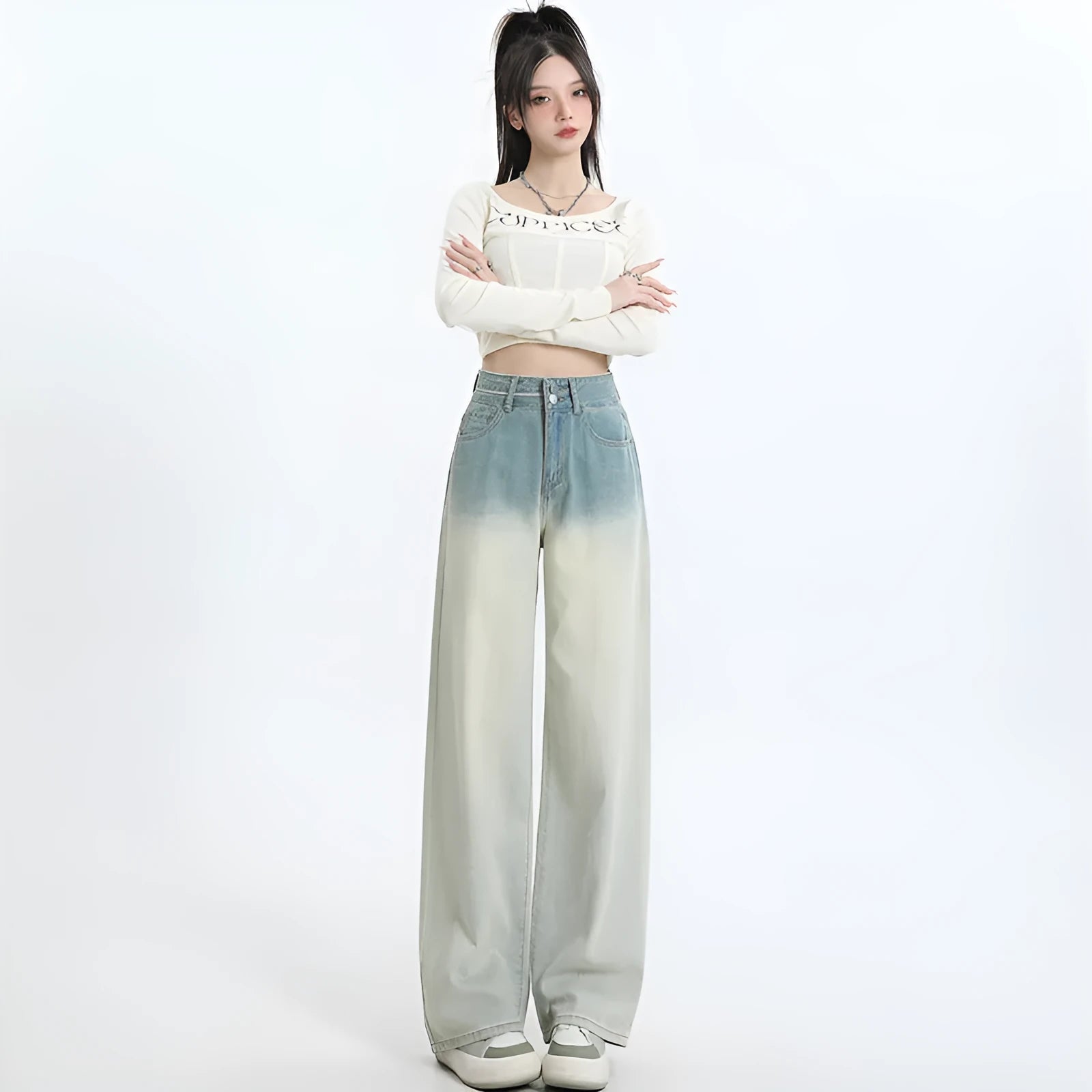 Gradient blue women's straight-leg denim trousers showing colour variation from light to dark blue tones