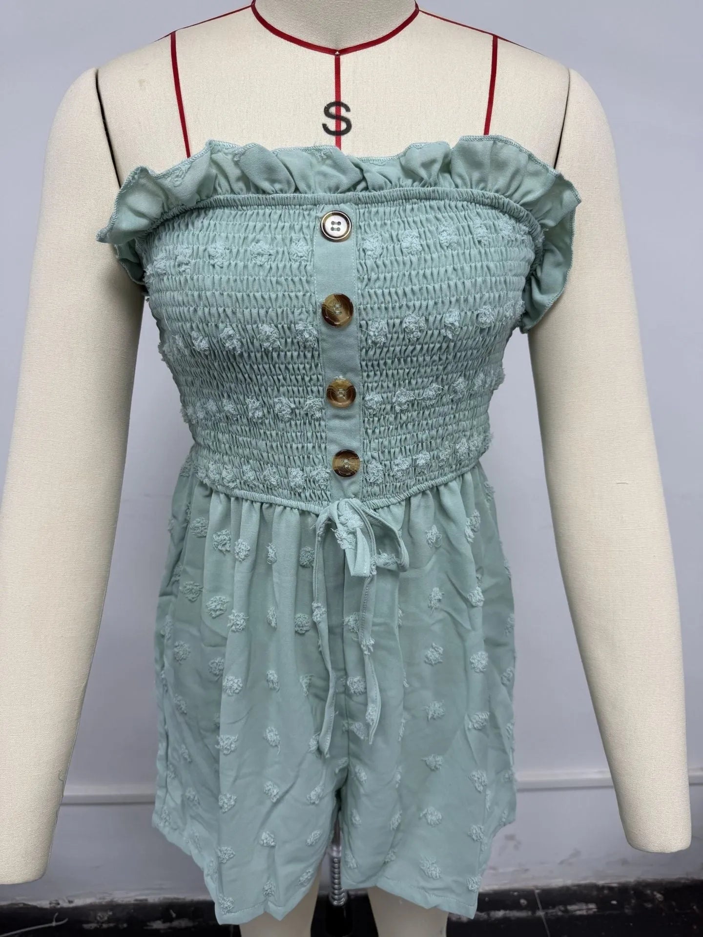 Blue sleeveless off-shoulder women's jumpsuit with button detail and mid waist fit