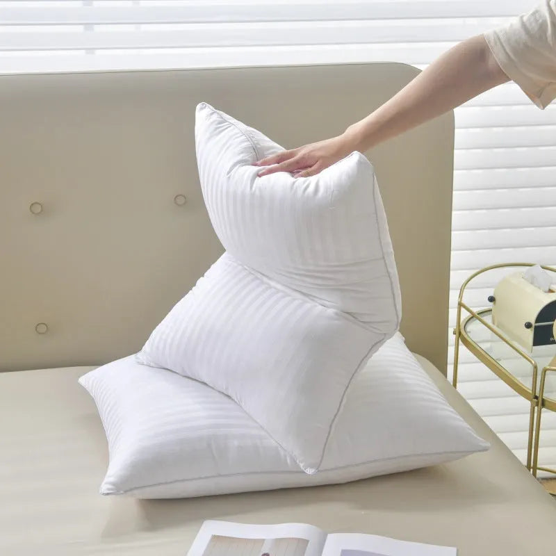 White hotel cotton satin stripe feather and cotton blend pillow showing satin stripe detail.