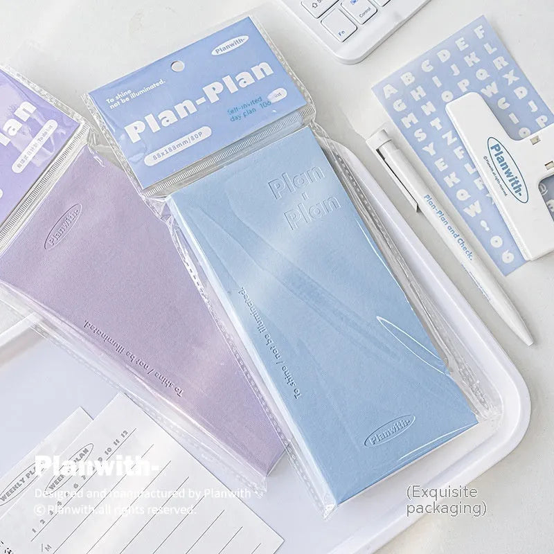 Embossed meter book notebook open showing white 100g paper, with blue, grey, purple, and white cover options.