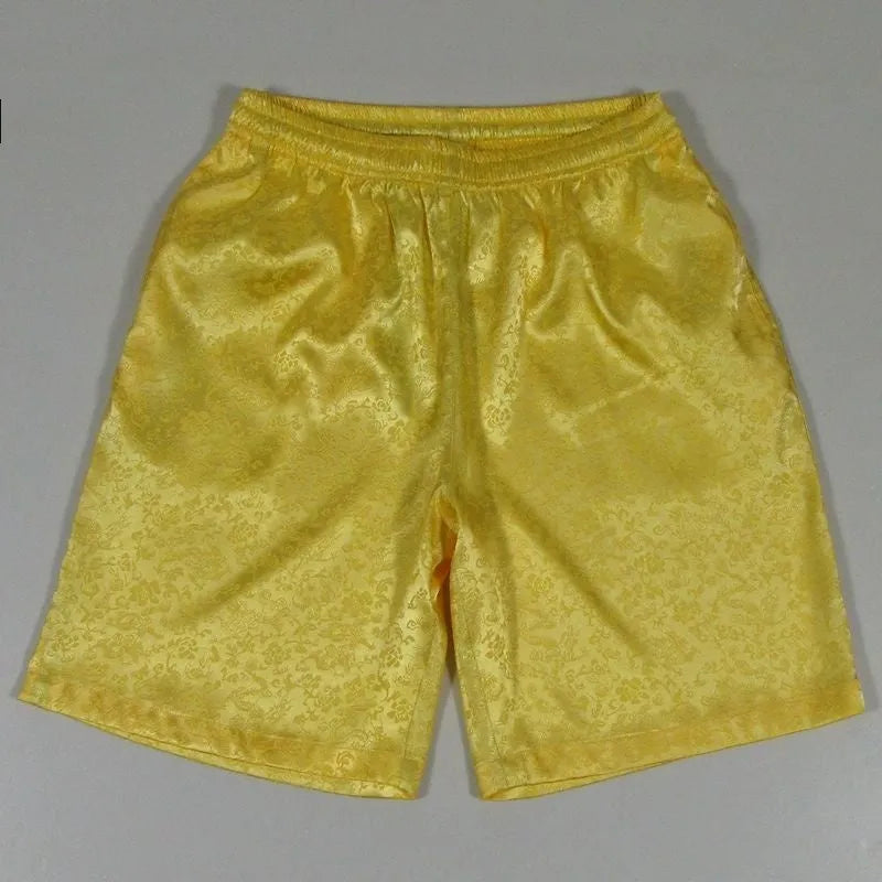 Men's black elastic drawstring Tai Chi shorts made from lightweight polyester fabric.