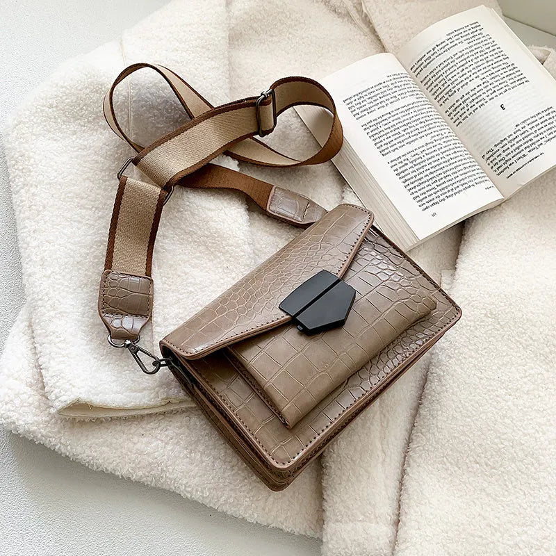 Vintage style crossbody bag in PU leather, shown in black, dimensions 20cm by 14cm.