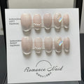 Women's handmade blush armour short faux nail set showing the 14-colour ladder A pattern.
