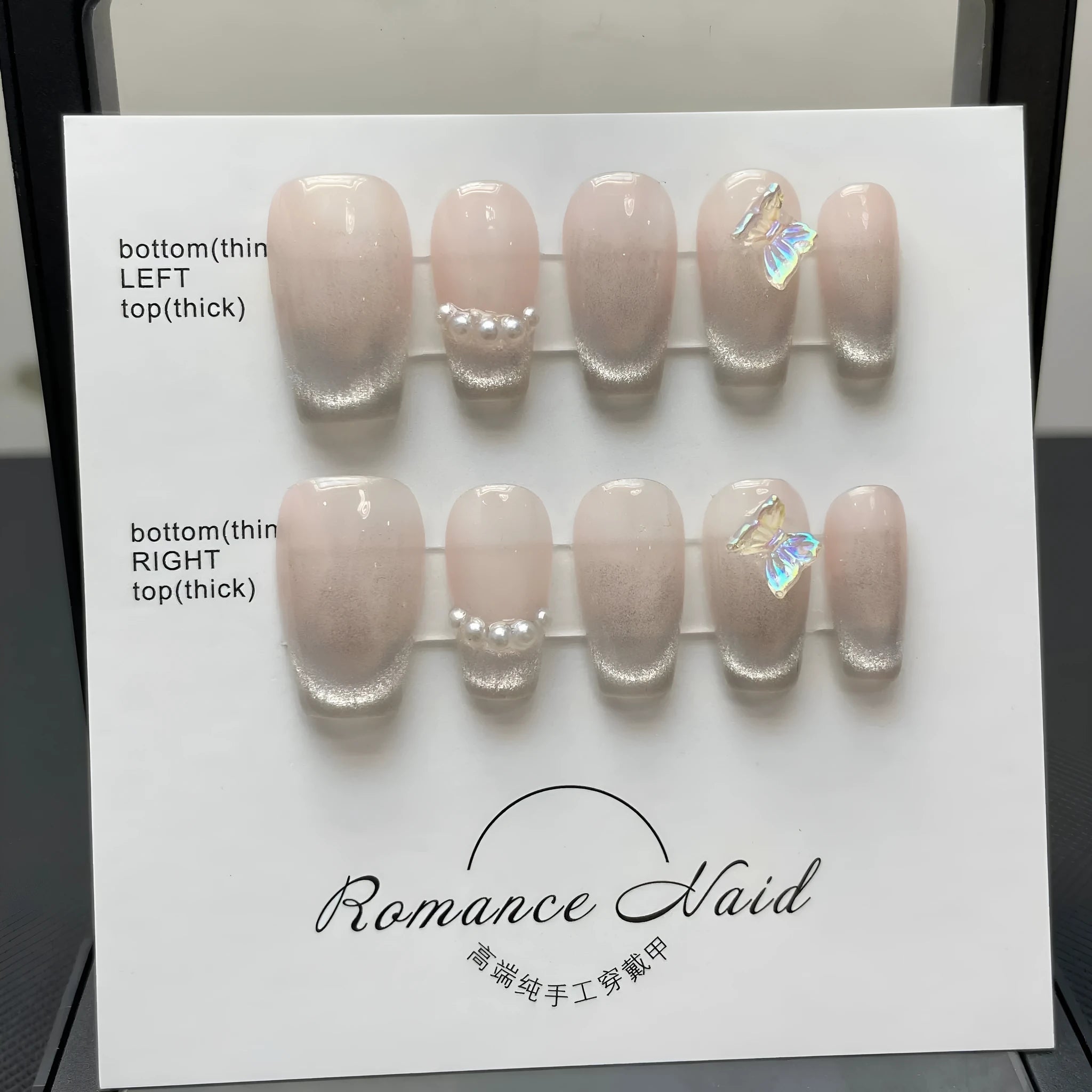 Women's handmade blush armour short faux nail set showing the 14-colour ladder A pattern.