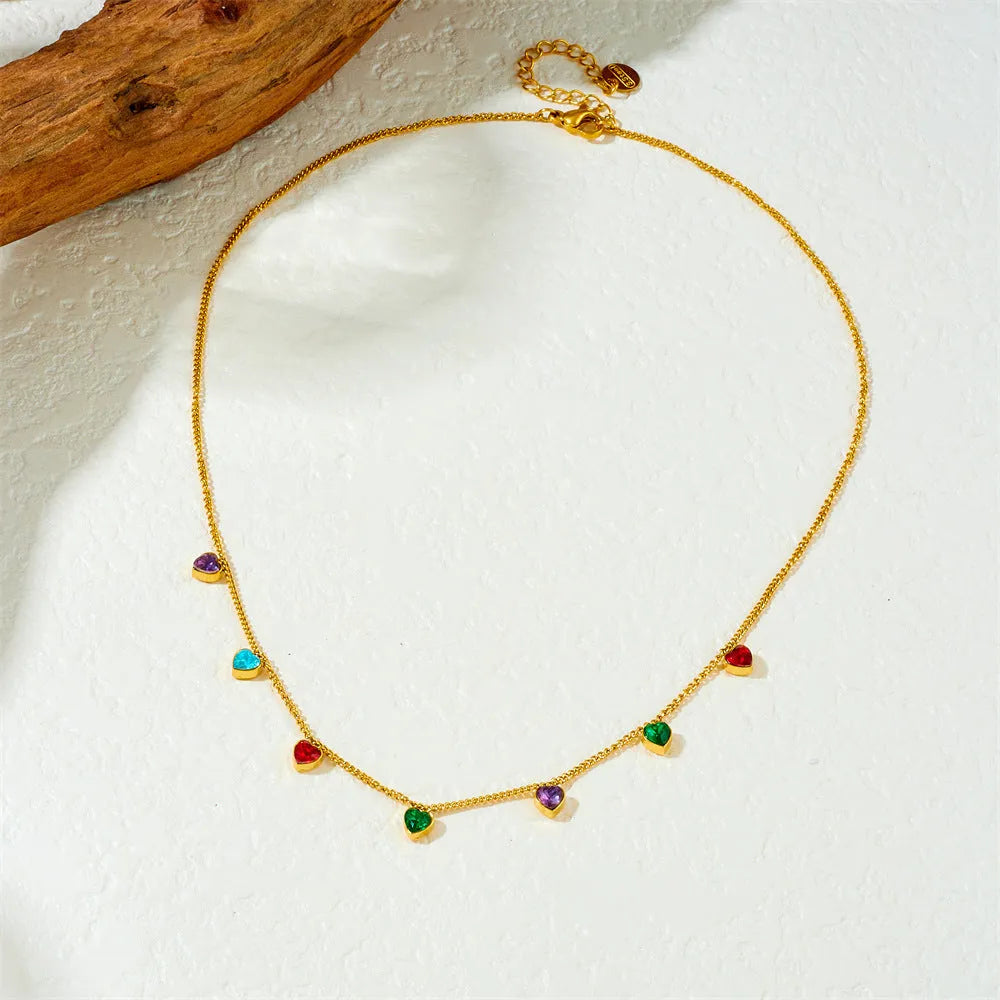 Gold-plated stainless steel necklace with a heart pendant on an adjustable chain.