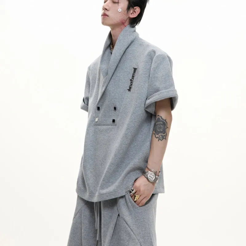 Men's dark grey cotton sports suit with V-neck jacket, padded shoulders, metal embellishments and matching shorts