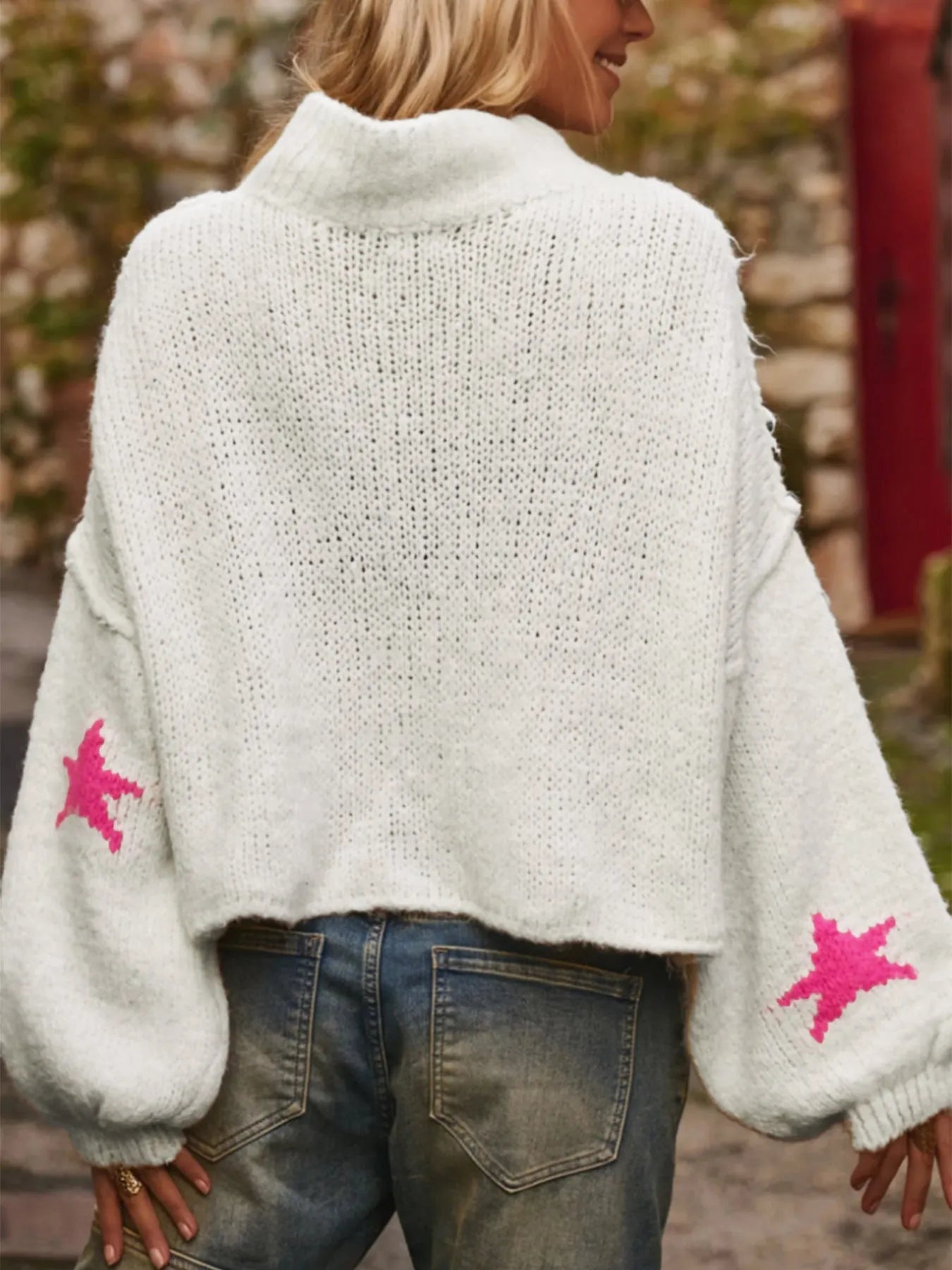 White women's turtleneck pullover with five-pointed star pattern and loose fit design