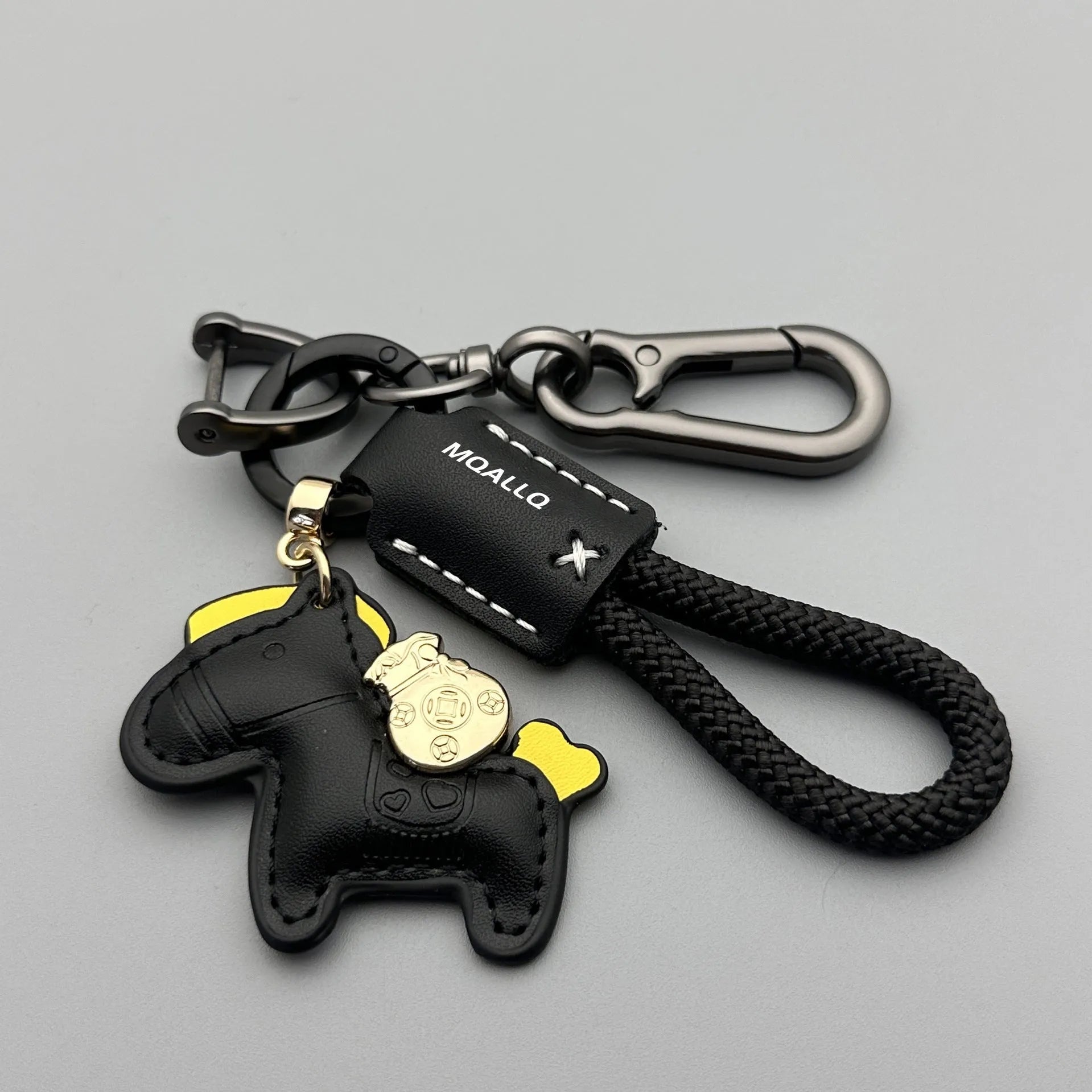 Handmade brown cowhide leather car key ring pendant with a zinc alloy belt buckle and green flanelle rope.
