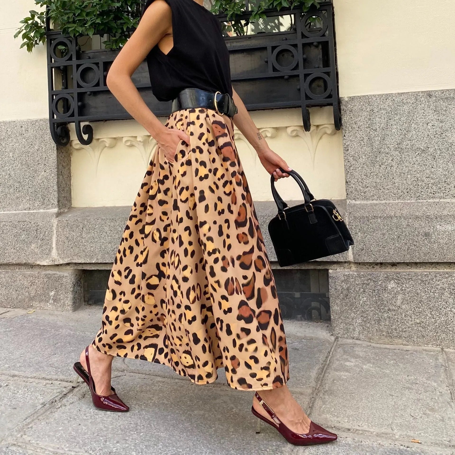 Brown leopard print women's long A-line skirt with a big hem.