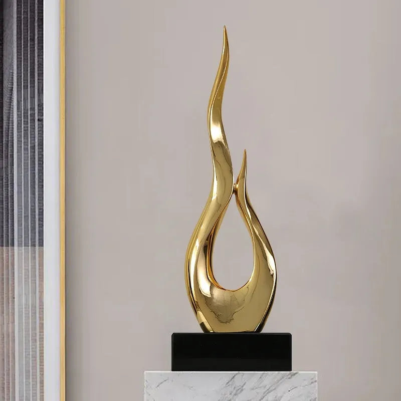 Festival high-rise decoration ornament in resin and plastic showing bright gold finish and modern simplicity style