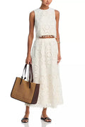 White women's sleeveless top and long skirt suit with retro embroidery detailing