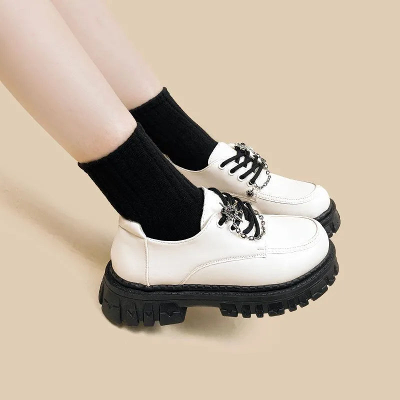 Women's preppy college loafers in Duke Asterism colour with cross shoulder straps and round toe design