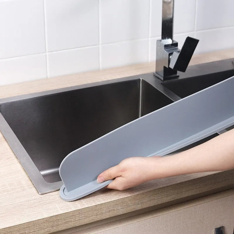 Grey silicone kitchen sink water blocking plate showing dimensions 52x5x85mm