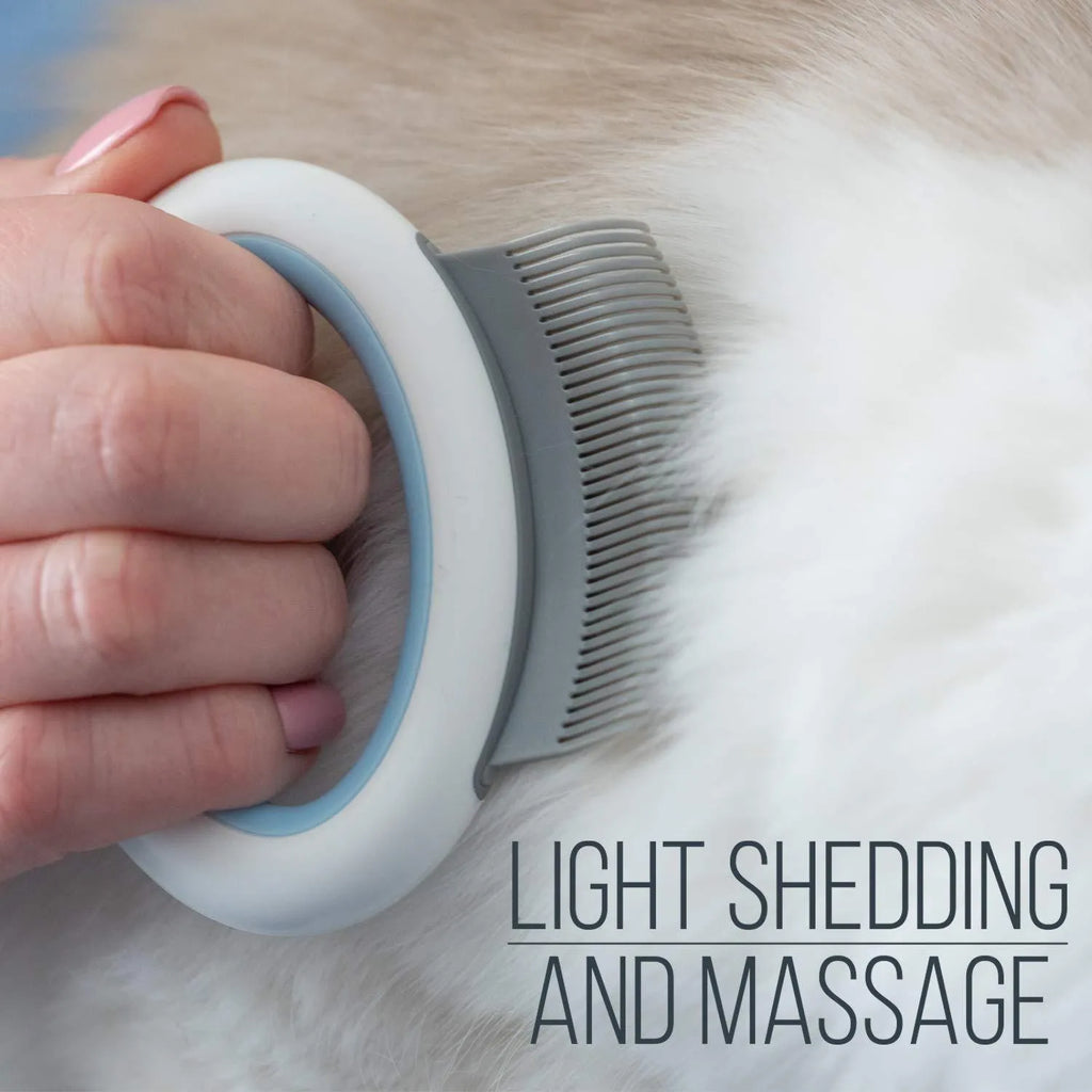 Blue pet grooming comb for deshedding cats and dogs on a white background.