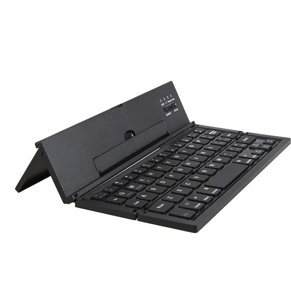 Black folding Bluetooth wireless keyboard next to tablet showing compact portable design