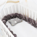 Soft spandex velvet baby crib bumper protector shown in a light grey colour, shaped around white crib bars.