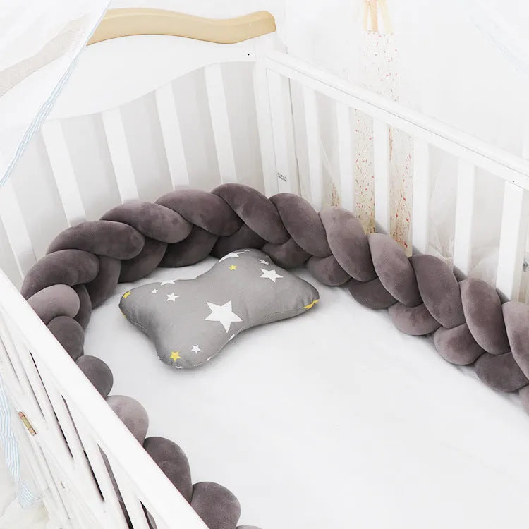 Soft spandex velvet baby crib bumper protector shown in a light grey colour, shaped around white crib bars.