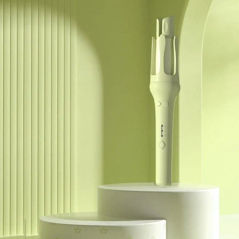 Automatic hair curler with 32mm ceramic barrel in pink, showing wired power cord and included US/EU travel adapters.