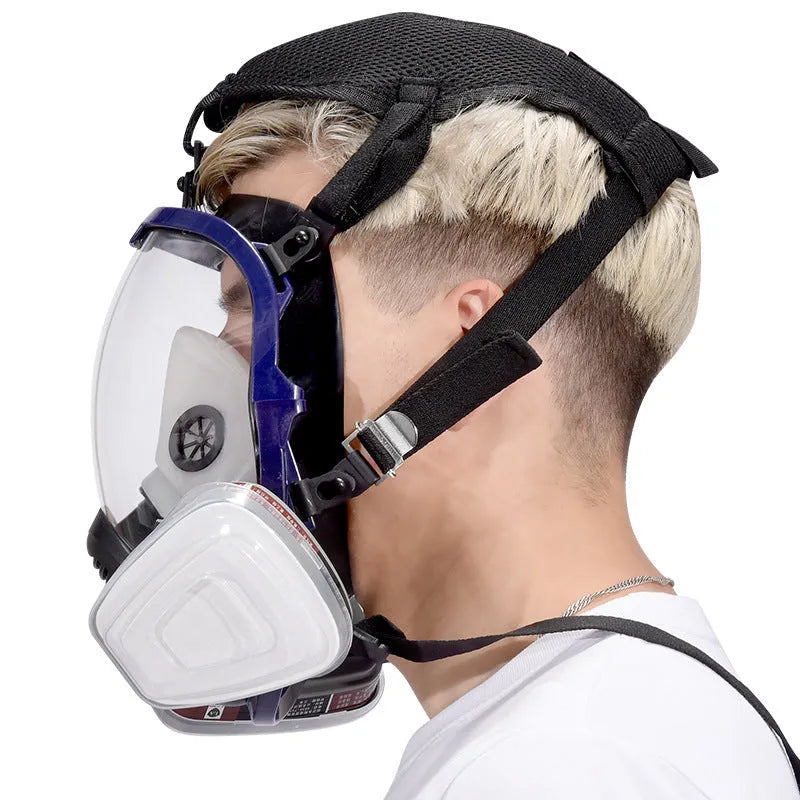 KN95 spherical full face gas mask with blue edge and trapezoidal canister containing activated carbon gauze filter