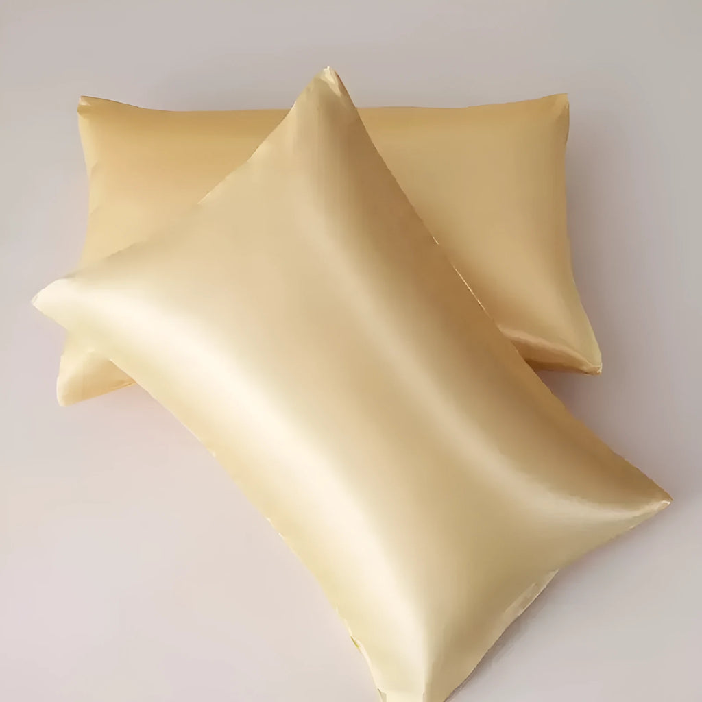 Pair of solid colour satin cloth pillowcases in polyester fibre available in twelve colours and four sizes
