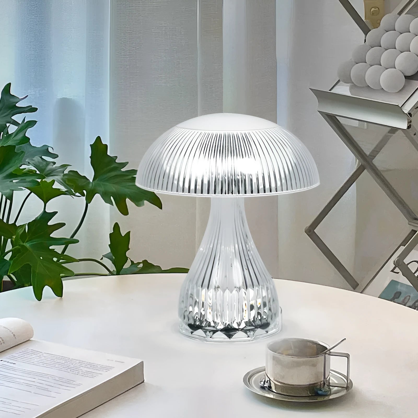 White rechargeable three-colour changing LED table lamp with acrylic light body.