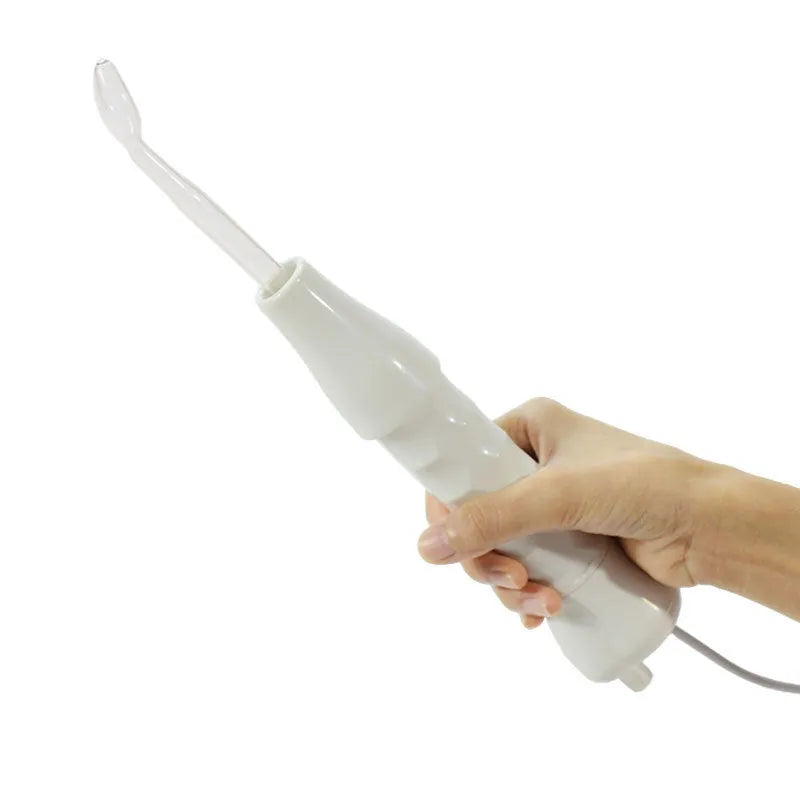White hand held high frequency electrotherapy comb with glass tube accessories for acne and mite removal in box packaging