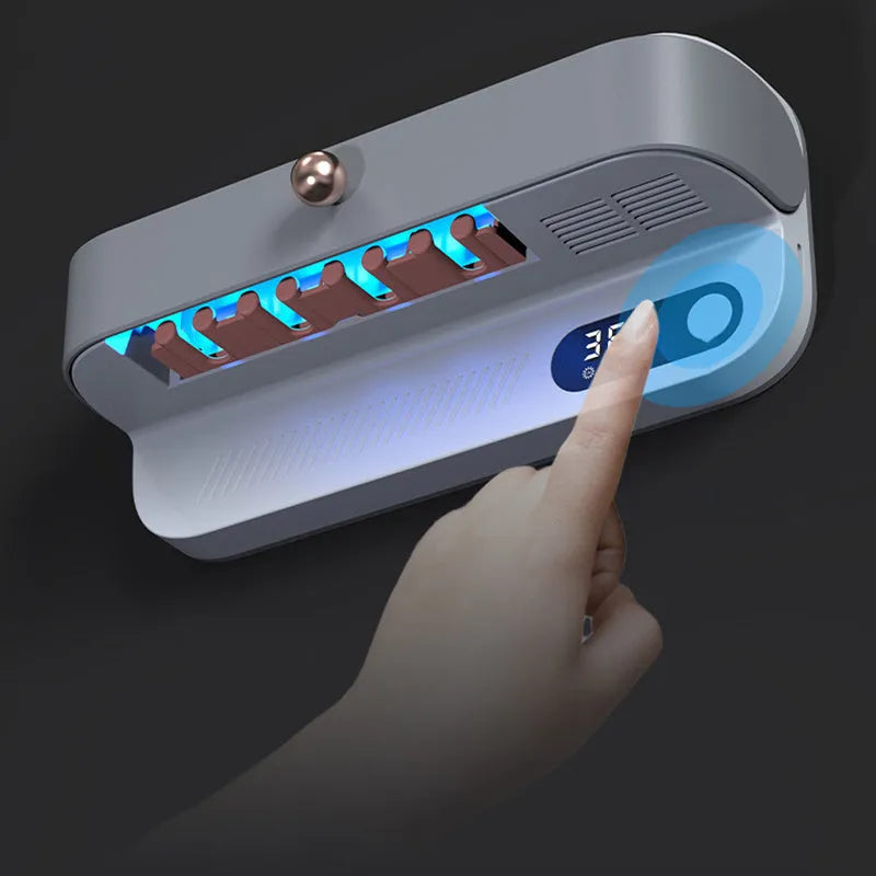 White smart wall-mounted toothbrush steriliser holder with UV light and USB charging port.