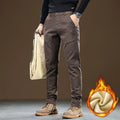 Men's fleece-lined slim fit tapered casual cotton trousers in black, shown flat for detail