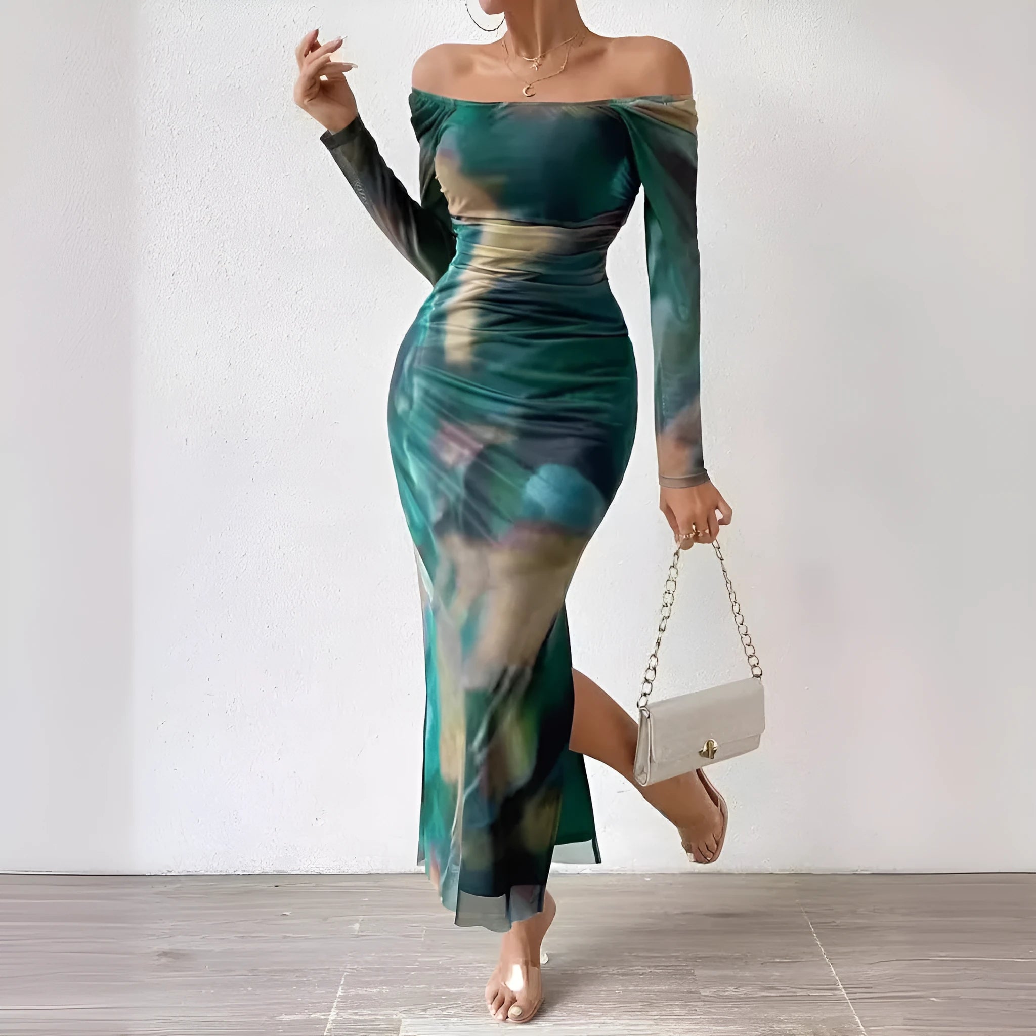 Long green mesh fishtail evening dress with a square collar, pleats, and a side split.